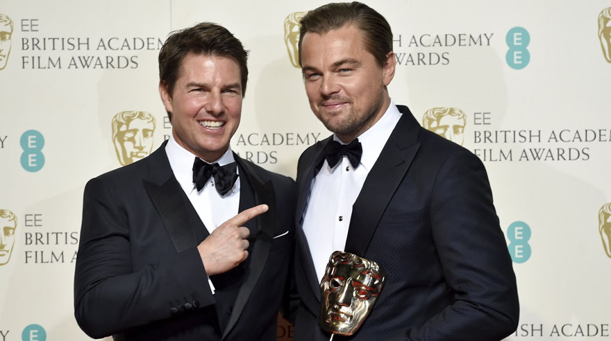 Leonardo DiCaprio holds his award for best leading actor as he stands with presenter Tom Cruise at the British Academy of Film and Television Arts (BAFTA) Awards at the Royal Opera House in London, February 14, 2016. REUTERS/Toby Melville